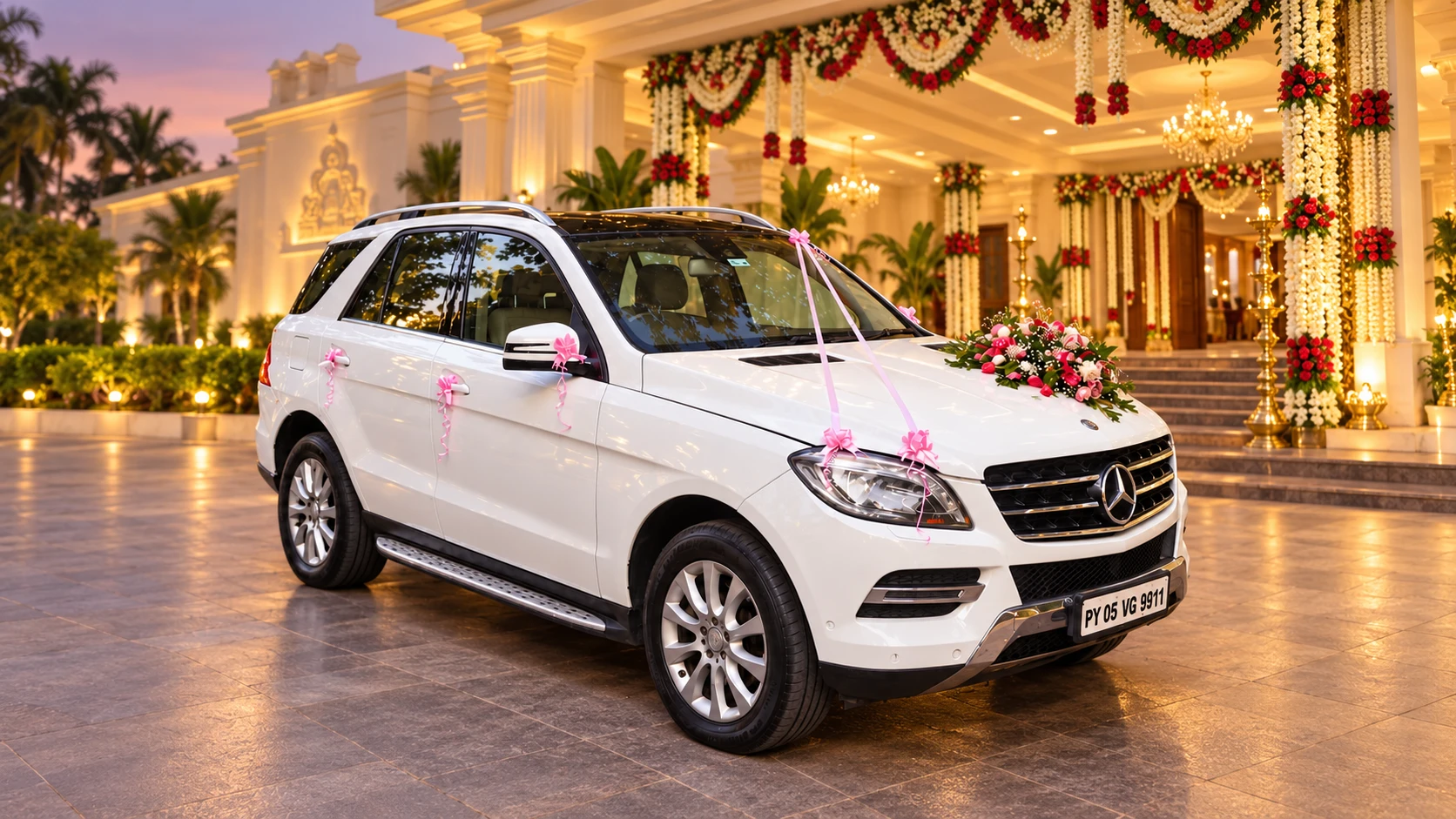 Our white Mercedes-Benz decorated for a wedding, with an enhanced mahal backdrop